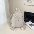 Versatile beige nylon backpack in crinkled fabric with drawstring closure and metal logo - Beige