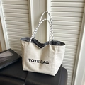 Borsa tote minimalista in tela color crema con stampa e manici in corda intrecciata - Bianco