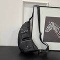 Chic black water-drop crossbody bag with dual snap pockets and adjustable strap - Black