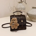 Dark brown faux leather crossbody bag with lychee texture and cute bear charm - With Pendant / Brown