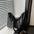 Minimalist black matte leather hobo shoulder bag with adjustable strap and soft texture - Black