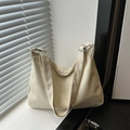 Minimalist cream-colored tote bag with pleated texture leather and silver buckle strap - Off White