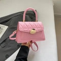 Pink quilted leather crossbody bag with crocodile pattern and golden metal twist lock - Pink