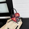 Heart-shaped crossbody bag with red and black poker print and silver chain detail - Black