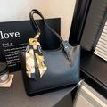 Black leather tote bag with contrast stitching and decorative silk scarf detail - Black