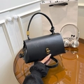 Fashionable black textured leather crossbody bag with vintage gold twist lock and knotted handle - Black