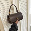 Vintage dark brown crossbody handbag with twisted handle and golden metal lock - Brown