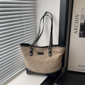Brown quilted tote bag with black trim and white stitching for stylish commuting - Khaki