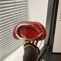 Red patent leather pillow bag with gold horseshoe handle and chain strap crossbody style - Red