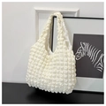 Close-up of white pleated popcorn texture fabric on a large minimalist shoulder tote bag - Off White