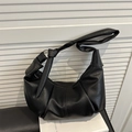 Retro black pleated dumpling shoulder bag in soft lychee textured leather finish - Black