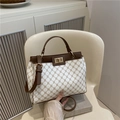 Retro cream crossbody bag with brown monogram pattern and golden metal lock closure - White