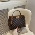 Retro dark brown crossbody handbag with vintage lock and adjustable shoulder strap - Brown