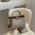 Vintage beige monogrammed canvas handbag with brown leather trim and gold lock closure - Khaki