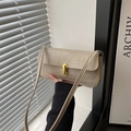 Elegant off-white croco-embossed baguette bag with golden buckle and sleek shoulder strap - Khaki