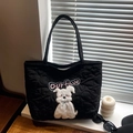 Black quilted heart tote bag featuring a plush puppy motif and Ourfave embroidery - Black