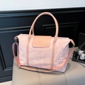 Roze waterdichte nylon reistas met imitatielederen handgrepen en schouderband - Roze
