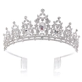 Detail of silver Baroque bridal crown featuring sparkling rhinestones and side hair combs - Silver