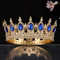 Detail of a gold baroque crown with large royal blue teardrop gems and white crystals - Gold White & Royal Blue