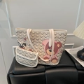 Chic beige tote bag with grey Y-pattern and cute cartoon bear print in interior setting - White