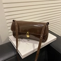 Deep brown patent leather shoulder bag with vintage gold buckle closure and glossy finish - Brown
