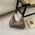 Detail of metallic bronze hobo bag featuring vertical stripes and silver zipper - Brown