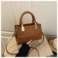 Brown patchwork retro crossbody bag with suede finish and woven handle detail - Brown