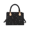 Chic black star pattern square handbag with braided handle and gold metal accents - Black