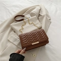 Brown quilted crossbody bag with gold chain strap and V-pattern stitching on soft PU leather - Brown