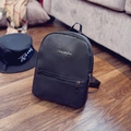 Mini black pebble leather backpack for kids with metal logo plate and zip pockets - Black