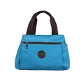 Blaue Canvas-Reisetasche mit braunen Griffen und rundem Leder-Markenlogo-Patch - Blau