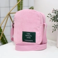 Minimalist pink corduroy crossbody bag with adjustable strap for casual daily outings - Lotus Pink