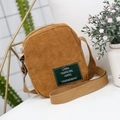Minimalist corduroy crossbody bag in yellow ginger finish with canvas strap for casual wear - Camel