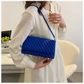 Detail view of royal blue quilted shoulder bag with classic diagonal stitching and sleek strap - Blue