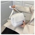 White faux shearling crossbody flap bag with adjustable strap for winter fashion - White
