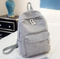 Minimalist light grey corduroy backpack for women in a cozy bedroom setting - Gray