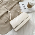 Crocodile pattern baguette bag in off-white faux leather with gold metal hardware - White