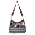 Bohemian woven shoulder bag with colorful fringe and ethnic patterned wide strap - Blue