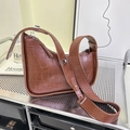 Brown crocodile embossed shoulder bag with wide adjustable strap and silver buckle - Brown