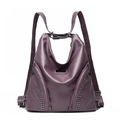 Purple faux leather backpack with silver rivets and zippers on a clean white background - Purple