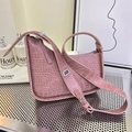 Dried rose pink shoulder bag with crocodile pattern and silver hardware in soft lighting - Pink
