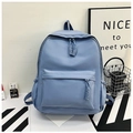 Detail of light blue nylon backpack with woven rope zipper and side water bottle pocket - Blue