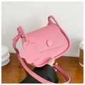 Minimalist light pink leather crossbody bag with round buckle and floral charm detail - Pink