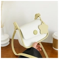 Minimalist beige crossbody square bag with light green trim and flower pendant - Yellow