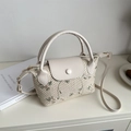 Straw woven handbag with flower embroidery and PU leather trim in creamy white - White