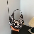 Hobo underarm bag with black and white zebra print and golden zipper closure - Zebra Print