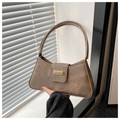 Detail of vintage brown baguette bag featuring matte texture and golden metal buckle - Coffee