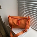 Bright orange nylon crossbody bag with wide strap and decorative plastic chain link - Orange