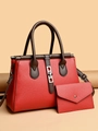 Borsa a mano rossa in pelle a grana con pochette coordinata e dettagli marroni - Rosso