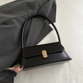 Classic black baguette bag with gold metal rotary buckle and slim shoulder strap - Black
